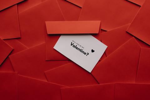 "Will you be my Valentine" invitation on a red background