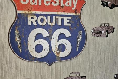 Route 66 Highway Sign highlighting SureStay Hotel